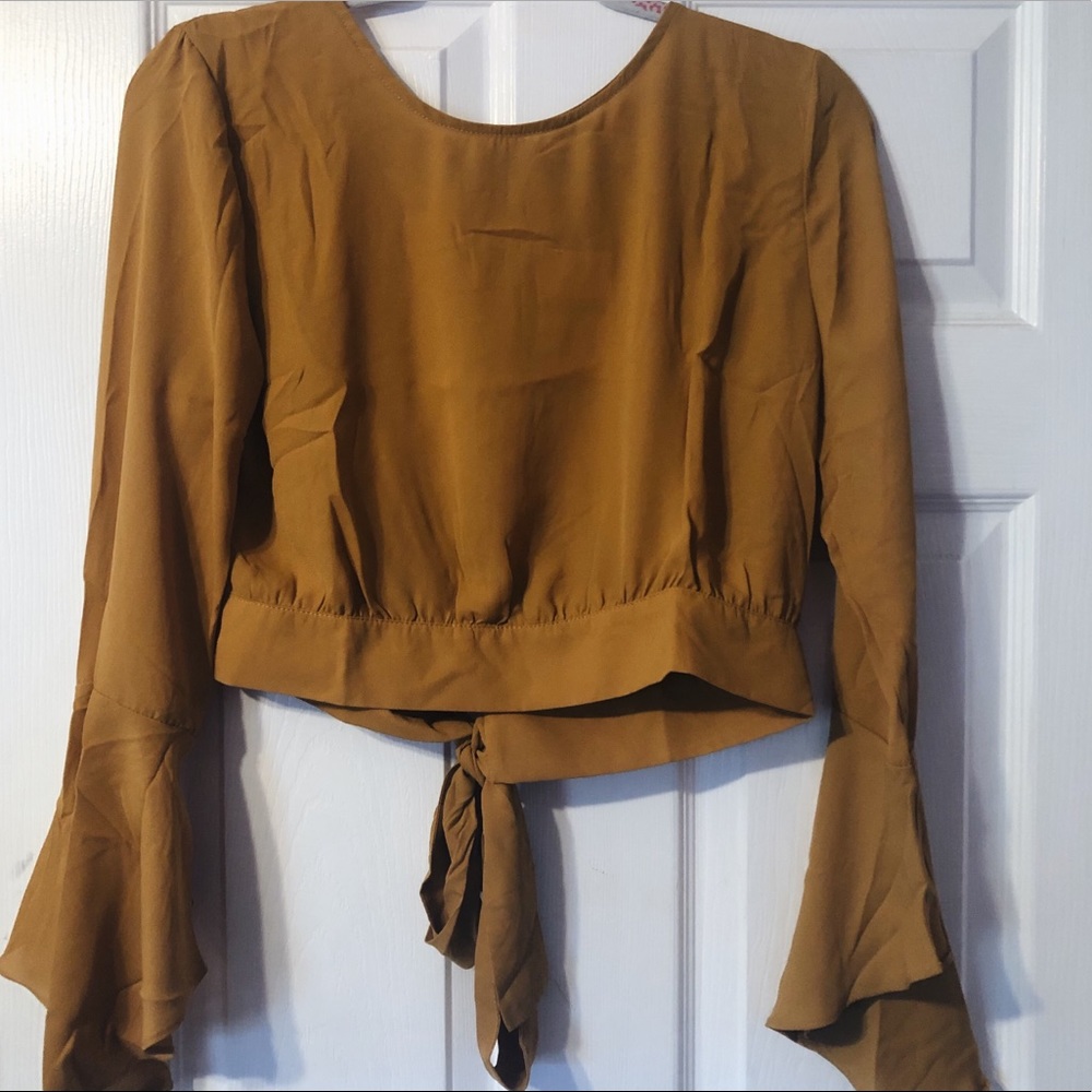 Mustard colored top.